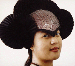 a classmate models a pink Kling helmet